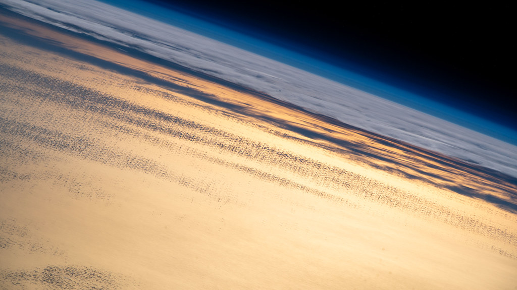 Flying into an orbital sunset above the Pacific Ocean